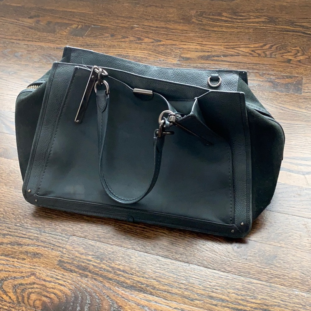 Coach leather and suede green tote with many pockets. Very good condition